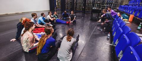 Open Space image a group sat in a semi circle on the floor