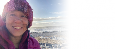 Jo Fong happy on a beach